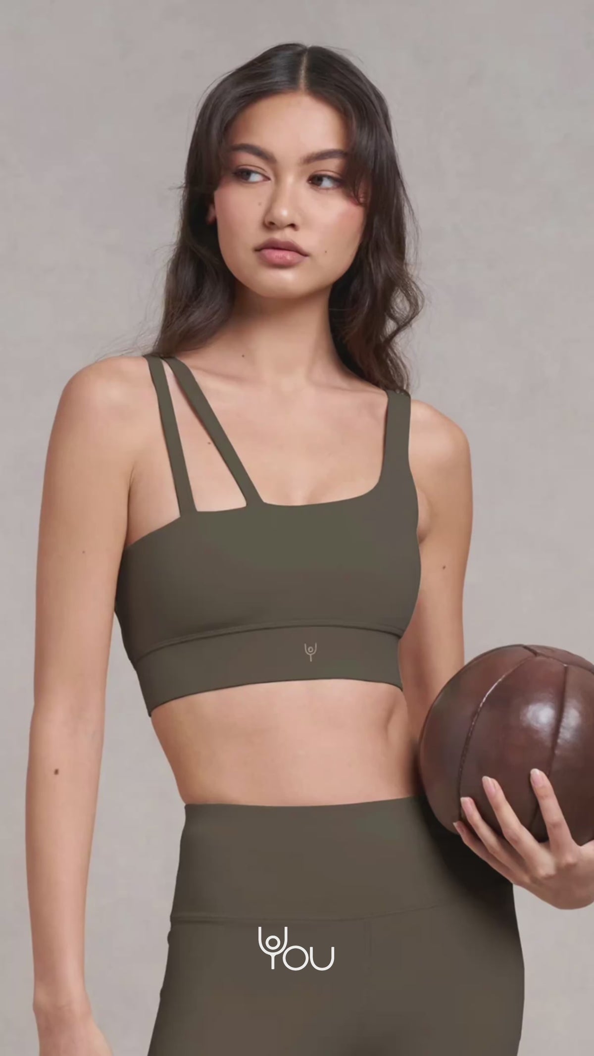 Ramble: a model in an olive green sports bra and leggings